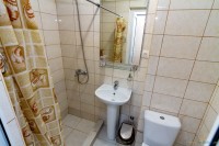 Новомихайловский кровать в номере отеля - Гостевой дом «Город - Сад»